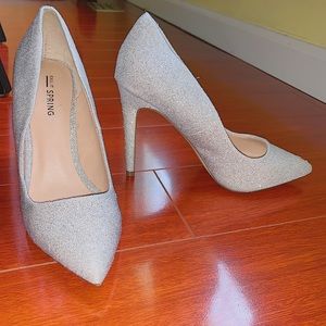 I am selling Call It Spring silver heels.